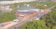  ?? Contribute­d, Joseph Dell, File ?? In this file photo, Crews spray water onto the DHM Adhesives fire in downtown Calhoun on Sept. 13, 2019, following the early morning chemical fire.