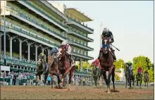  ?? JEFF ROBERSON/AP PHOTO ?? Jockey John Velazquez riding Authentic, right, crosses the finish line to win the 146th running of the Kentucky Derby at Churchill Downs.