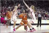  ?? CHARLIE NEIBERGALL ASSOCIATED PRESS ?? IOWA STATE’S Denae Fritz, left, and Emily Ryan defend against Rori Harmon in a Cyclones home win.