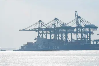  ?? — AFP photo ?? This picture shows container vessels docked at Pasir Panjang port terminal in Singapore.