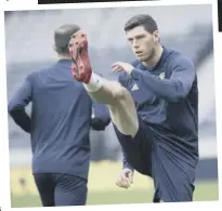  ??  ?? 2 Scott Mckenna is put through his paces at Hampden yesterday ahead of tonight’s win-or-bust Nations League clash with Israel.