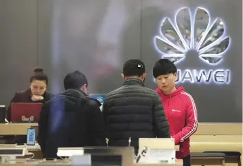  ?? Reuters ?? A Huawei store in Beijing. Europe, the Middle East and Africa account for 27 per cent of the company’s revenue.