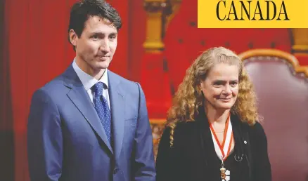  ?? ADRIAN WYLD / THE CANADIAN PRESS ?? Julie Payette stands alongside Prime Minister Justin Trudeau in the Senate chamber during her installati­on as Governor General in 2017.