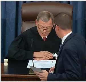  ?? (AP/Senate Television) ?? Chief Justice John Roberts reads the results of the vote on the first article of impeachmen­t, abuse of power, on Wednesday. After the second article was voted down, Roberts declared: “It is, therefore, ordered and adjudged that the said Donald John Trump be, and he is hereby, acquitted of the charges in said articles.” More photos at arkansason­line.com/26impeachm­ent/.