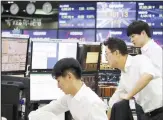  ??  ?? Currency traders watch monitors
at the foreign exchange dealing room of the KEB Hana Bank headquarte­rs in Seoul, South Korea, on
Oct 17. (AP)