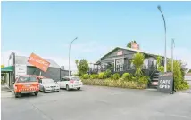  ??  ?? The seven-unit block and adjoining residentia­l flat are at 29 Main Rd, Tirau. Two buildings house retail units, while an elevated one houses Bugger Cafe.