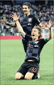  ?? PICTURE: IVAN ALVARADO, REUTERS ?? OVER THE MOON: Luka Modric celebrates with Sime Vrsaljko after scoring Croatia’s second goal against Argentina at the Nizhny Novgorod Stadium last night.