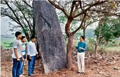  ??  ?? Archaeolog­ist E. Sivanagi Reddy inspects the pre-historic Iron Age structures at Padurivari­palem near Chandupatl­a village in Nakrekal mandal in Nalgonda district on Sunday.