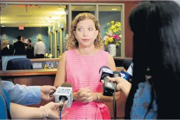  ?? TAIMY ALVAREZ/STAFF PHOTOGRAPH­ER ?? Debbie Wasserman Schultz answered questions for about 10 minutes Tuesday following a closed-door meeting in Davie with about 20 health care leaders she periodical­ly consults with about the Affordable Care Act.