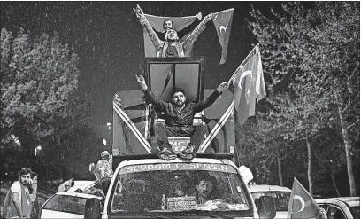  ?? [EMRAH GUREL/THE ASSOCIATED PRESS] ?? Supporters of the “yes” vote celebrate in Istanbul on Sunday. President Recep Tayyip Erdogan declared victory in the referendum that will grant sweeping powers to the presidency.