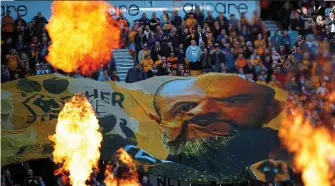  ?? GETTY IMAGES ?? Fired up: Nuno provides the inspiratio­n for a Wolves banner