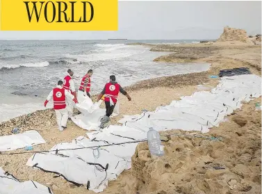  ?? AL-ZAWIYAH BRANCH — LIBYAN RED CRESCENT / AFP ?? Libyan Red Crescent volunteers recovering the bodies of 74 migrants that washed ashore on Libya’s northern coast. The humanitari­an group said there are bodies still floating out at sea, but it has no means to retrieve them.