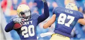  ?? PAUL W. GILLESPIE/BALTIMORE SUN MEDIA GROUP 2015 ?? Calvin Cass Jr. celebrates a touchdown in Navy’s 31-14 victory over Tulane last year. Cass’ mother will miss the game when the Midshipmen play the Green Wave again Saturday.