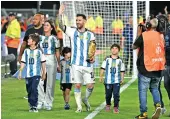  ?? ?? Lionel Messi celebrates with his wife Antonela Roccuzzo and their children