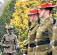  ??  ?? A statue of Lieutenant Colonel Malone looks on as members of the 5/7 Battalion of the Royal New Zealand Infantry Regiment marched past in a parade in 2015.