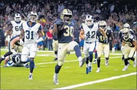  ?? Butch Dill Associated Press ?? NEW ORLEANS SAINTS running back Boston Scott runs for a touchdown in the first half en route to a shutout against the Rams in the final preseason game.