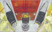  ?? ISRO ?? The IRNSS-1G satellite is integrated with the PSLV-C33 with two halves of the heat shields.