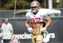  ?? ANDA CHU — BAY AREA NEWS GROUP ?? The 49ers’ Nick Bosa jogs at a training camp workout in Santa Clara on Tuesday.