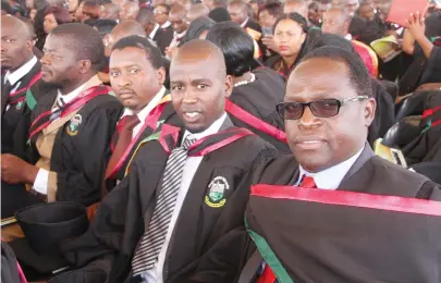  ??  ?? Herald Senior Assistant Editor George Chisoko (right), Mr Bruce Thambo and Zimpapers staffer Pedzisai Sibanda (centre) graduated at Great Zimbabwe University yesterday