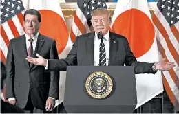  ?? EVAN VUCCI/AP ?? President Donald Trump addresses Japanese business leaders Saturday in Tokyo to start a largely ceremonial four-day visit. William Hagerty, the U.S. ambassador to Japan, listens.