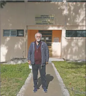  ??  ?? Damianos poses outside the building of Avlona’s prison school.