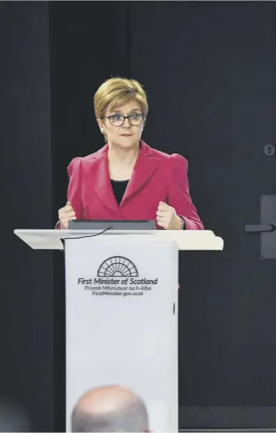  ??  ?? 0 First Minister Nicola Sturgeon – watched by Chief Medical Officer Dr Catherine Calderwood – unveils