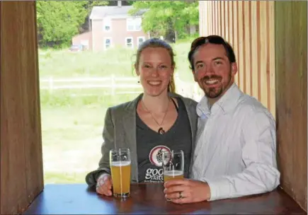  ??  ?? Good Nature Brewing owners Carrie Blackmore and Matt Whalen enjoy a moment during a grand opening celebratio­n at the brewery on Wednesday, June 7.