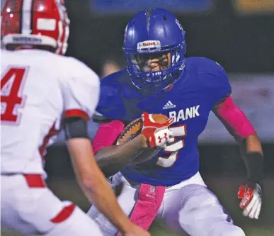  ?? STAFF PHOTO BY ERIN O. SMITH ?? Red Bank wide receiver Calvin Jackson (5) runs the ball downfield Friday night during the Lions’ 49-24 Region 3-3A defeat of visiting Loudon.