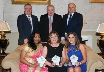  ??  ?? Moorehall Living staff Annie Rateesh, Ruth Devlin and Aisling Kerr with their Resident and Family Appreciati­on Awards at the staff recognitio­n night at Bellingham Castle. The winners are pictured with Sean McCoy, Gavin Duffy and Michael McCoy. Photos,...