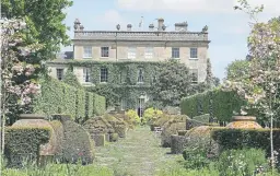  ?? ?? INSPIRATIO­N: Above, the gardens at Highgrove House. Burberry have launched a new collection of scarves (opposite) and trench coats – with the famous check lining swapped for floral illustrati­ons inspired by Highgrove.
