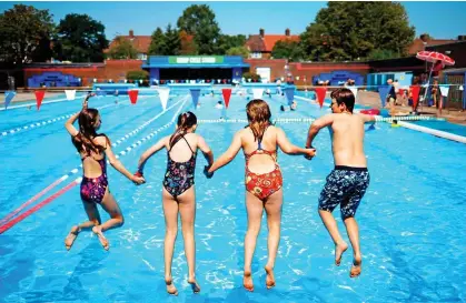  ??  ?? JUMP TO IT: Book early for pools such as Charlton Lido, above, as social distancing rules will limit numbers