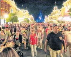  ??  ?? Visitors leave Magic Kingdom before the park closed March 15, the last day a Walt Disney World theme park was operating.