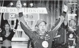  ?? Daniel Shirey Getty Images ?? BRAD KESELOWKI whoops it up after winning Sunday’s NASCAR Monster Energy Cup race. Keselowski surged ahead with only six laps to go and held on.