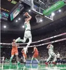  ?? BOB DECHIARA/USA TODAY SPORTS ?? Celtics center Kristaps Porzingis (8) dunks the ball during the second half of Wednesday’s game against the Oklahoma City Thunder at TD Garden in Boston.