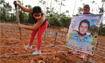  ??  ?? A protester at the site of a common grave for coronaviru­s victims in Peru demands proper burial for her relative. Photograph: Cesar von Bancels/AFP/Getty Images