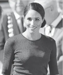  ?? CHARLES MCQUILLAN GETTY IMAGES ?? The Duchess of Sussex Meghan Markle favours brands like Roland Mouret and Givenchy (seen here).