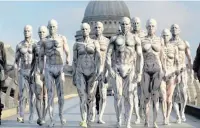  ??  ?? Models turned into ‘humanoid’ robots pose on London’s Millennium Bridge to launch new TV series Westworld