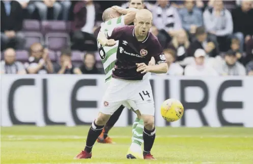  ??  ?? 0 Steven Naismith’s work ethic as well as his ability on the ball have been instrument­al in Hearts’ improvemen­t says Allan Johnston.