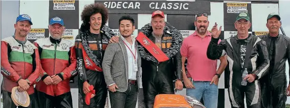  ??  ?? The sidecar podium for both heats was identical, with winners Eddy Wright and Kieran Clarke (sporting an Afro-hairstyle) in the centre, runners-up Alun Thomas (far left) and Keith Walters, and (right) Tony Thirkell with passenger Trevor Johnson.