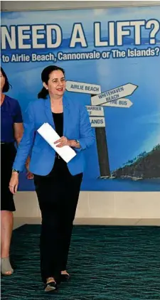  ?? PHOTO: DARREN ENGLAND/AAP ?? YES PLEASE: With a battle on her hands in the Queensland election, the backdrop at Whitsunday Coast Airport sums it up for Premier Annastacia Palaszczuk yesterday.