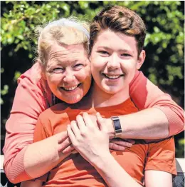  ??  ?? Strong son Darren, pictured with mum Liz, has made a remarkable recovery