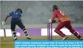  ?? — AFP ?? DHAKA: Zimbabwe wicketkeep­er Brendan Taylor (R) breaks the stumps of the Sri Lanka cricketer Danushka Gunathilak­a (L) during the second One Day Internatio­nal (ODI) cricket match of the Tri-Nations Series between Sri Lanka and Zimbabwe at the...