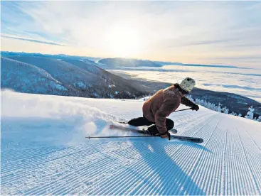  ??  ?? Parallel universe: Ben Collins, below, loves skiing because it combines his passion for getting fit with his love of the great outdoors