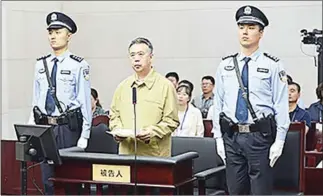  ??  ?? This handout photo taken on Tuesday shows former Interpol chief Meng Hongwei (centre) during his trial at the court in Tianjin, northern China.