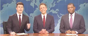  ??  ?? Seth Meyers, centre, returns to the 'Weekend Update' desk alongside Colin Jost (left) and Michael Che. — Photo by NBC