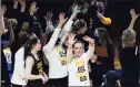  ?? Ronald Cortes / Associated Press No. 8 Syracuse in the Sweet 16. ?? Iowa guard Caitlin Clark (22) and the rest of the team acknowledg­e the fans after defeating Kentucky in the second round of the NCAA tournament on Tuesday.