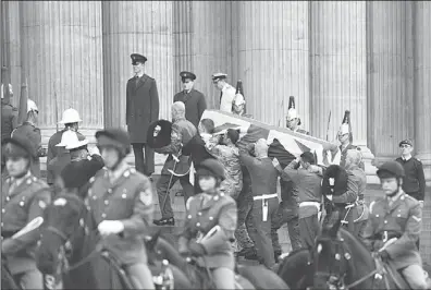  ??  ?? Bearer Party from the three military services carry a coffin up the steps of St Paul’s Cathedral during a rehearsal for the ceremonial funeral of former British prime minister Margaret Thatcher in Central London on April 15. Thatcher, who died on April...