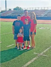  ?? PROVIDED] [PHOTO ?? Yukon football coach Jeremy Reed is pictured with his wife Brooke and their three children - 12-year-old Peyton, left, 8-year-old Jeymon, middle, and 3-year-old Rylan.