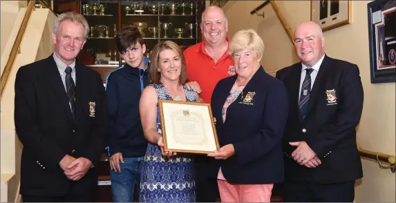  ??  ?? Sheila Crowley Lady Captain presenting the Killarney Golf and Fishing Club Life Honorary Life Time membership scroll to Bridget Gleeson Healy for Golfing Achievemen­ts with her son and husband Liam, Jack Buckley President, Derry McCarthy Captain at...