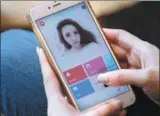  ?? REUTERS ?? A woman uses an app developed by Meitu Inc to beautify her